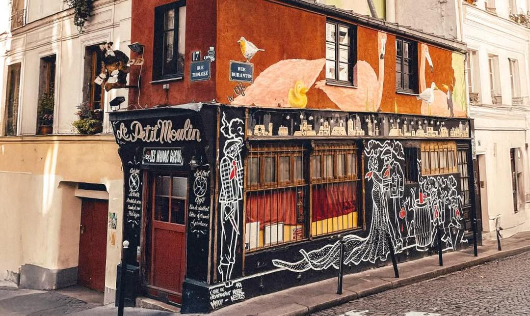 Historic Paris café exterior near Montmartre, part of chocolate and pastry tour