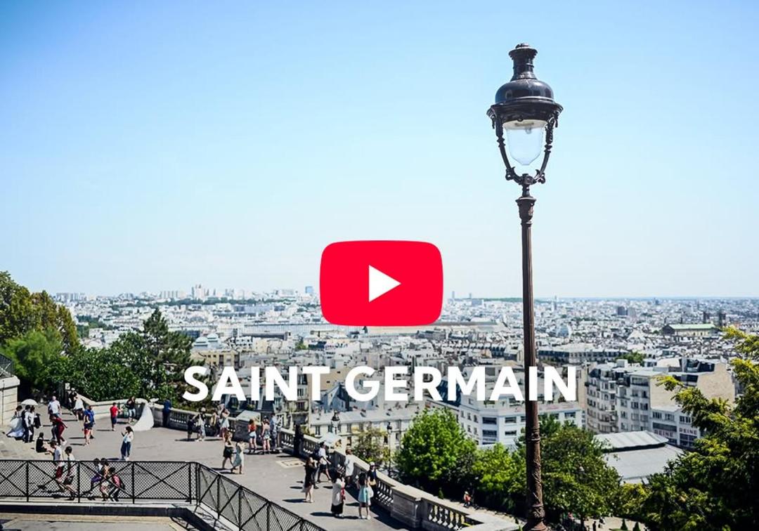 View over Paris rooftops with a lamppost in the foreground, video thumbnail