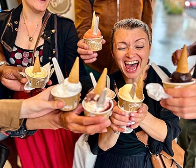 Guests enjoying street food together on a guided walking food tour