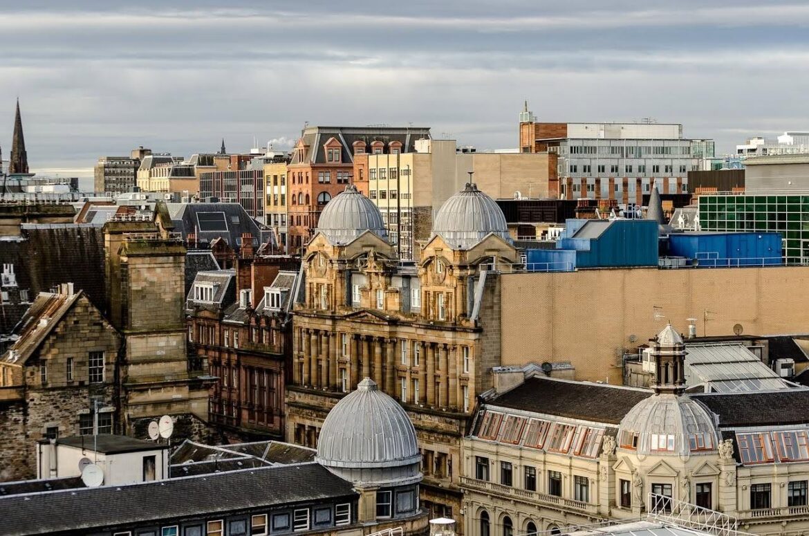 View of Glasgow city skyline featuring historic architecture and modern buildings in Scotland.
