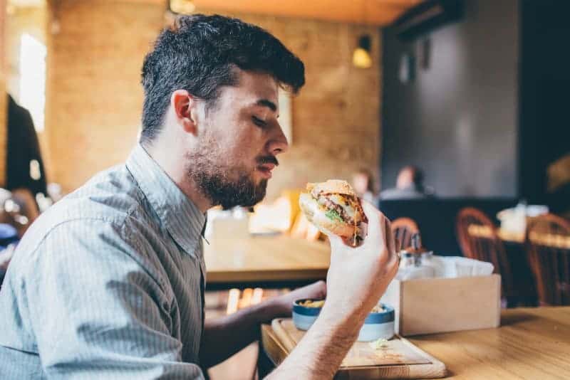 Guest eating a burger
