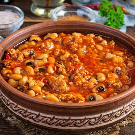 chili con carne in a bowl on wooden background me