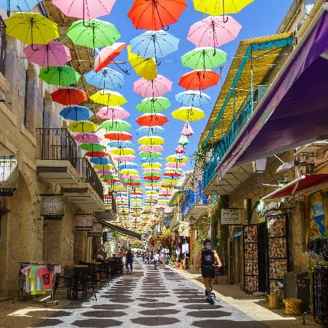Pedestrians and colorful umbrellas 