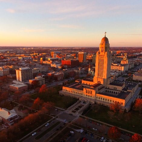 the sun sets over the state capital building