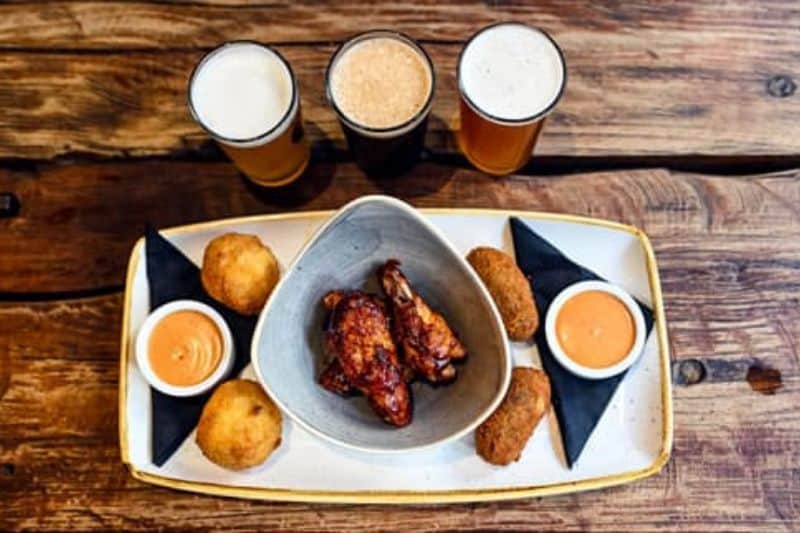 Beer, chicken wings and croquettes