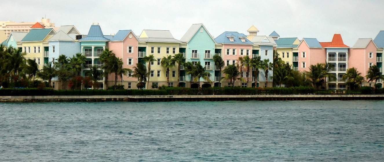 pastel houses all in a row on the water