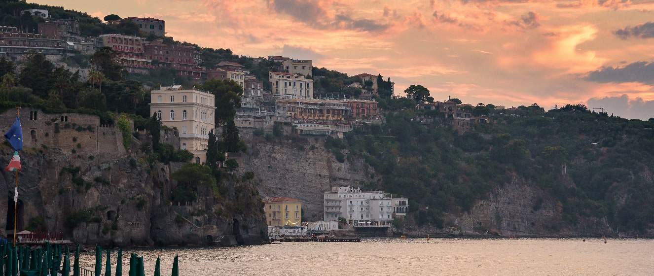 cliff coast in sorrento town at sunset